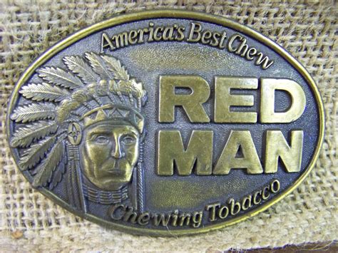 The buckle&x27;s design showcases an Art Deco look with a Native American theme, making it a unique and highly sought-after access. . Redman belt buckle
